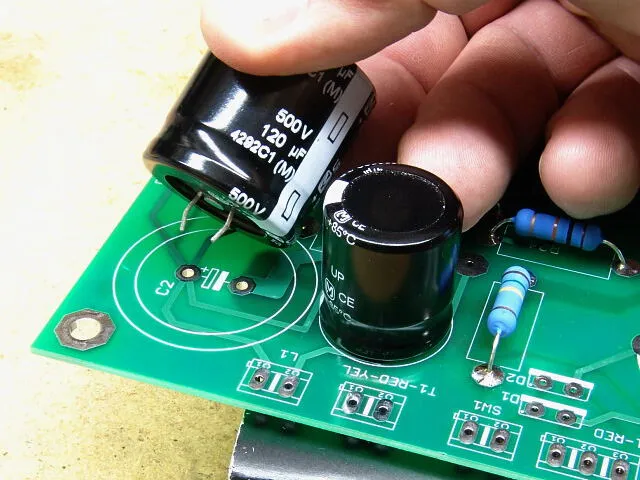 Capacitors mounted on a printed circuit board.