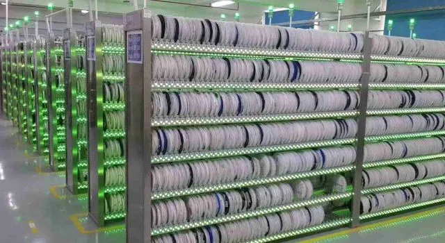 A warehouse with shelves full of electronic components including capacitors.