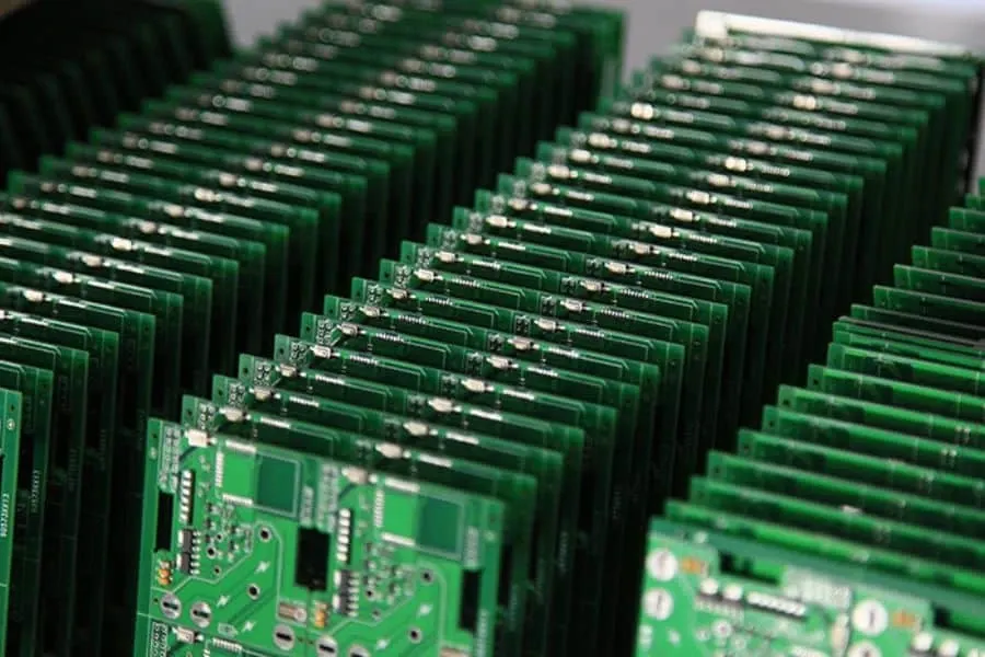 A large quantity of PCBs being manufactured on an assembly line.