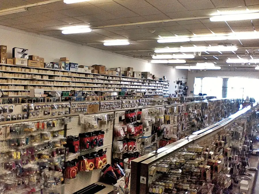 A shelf filled with various electronic components in a retail store.