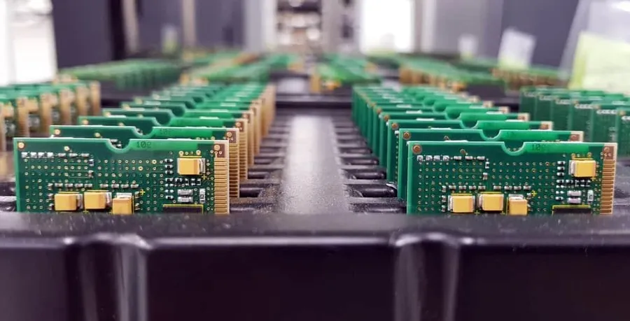 A wide shot of a PCB manufacturing factory floor with various machinery.