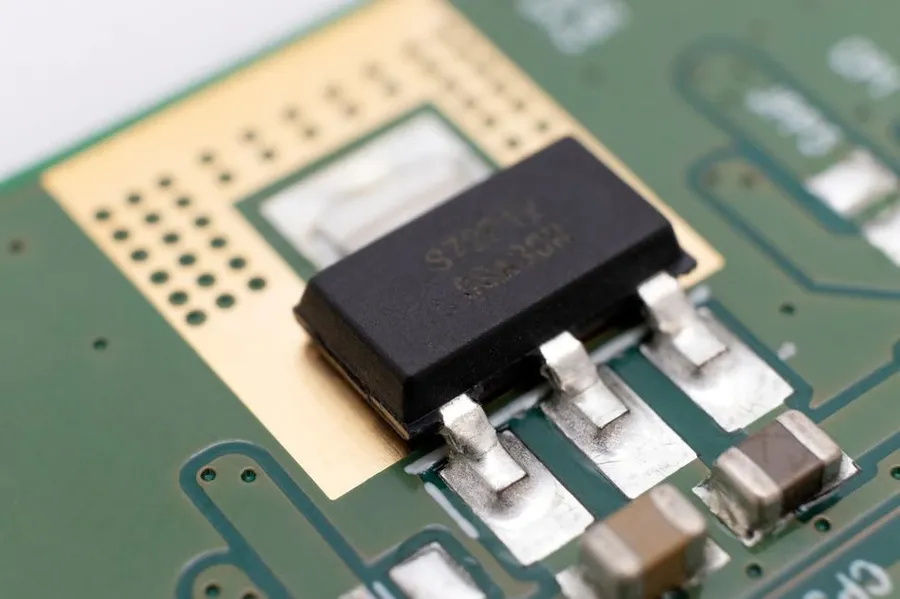 Various surface mount components soldered on a PCB.