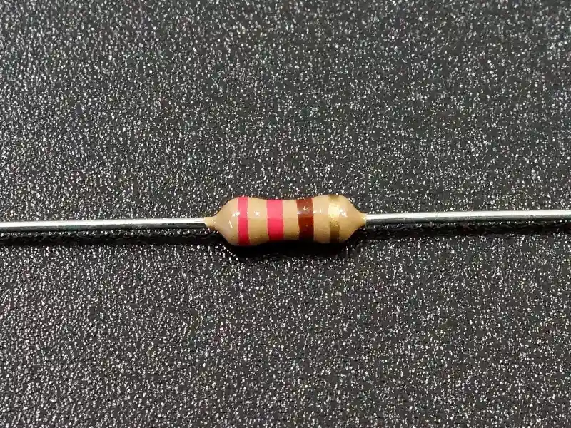 A circuit board with 220 ohm resistors soldered in place.