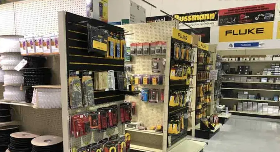 Shelves stocked with various electronic components in a retail store.