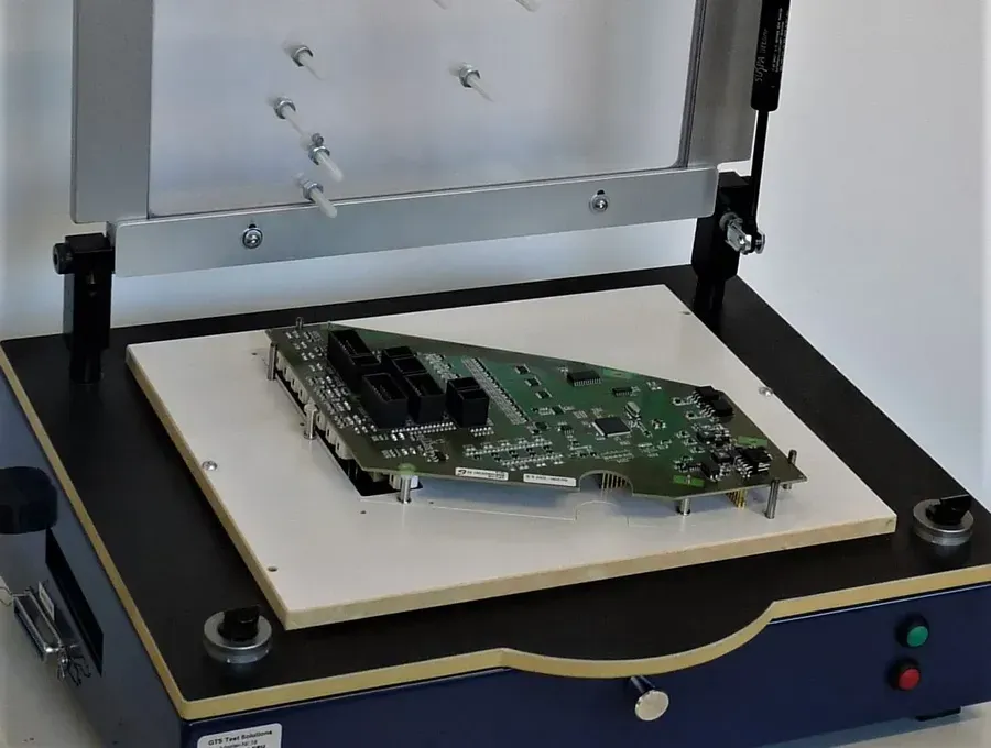 A technician performing a functional test on a PCB.