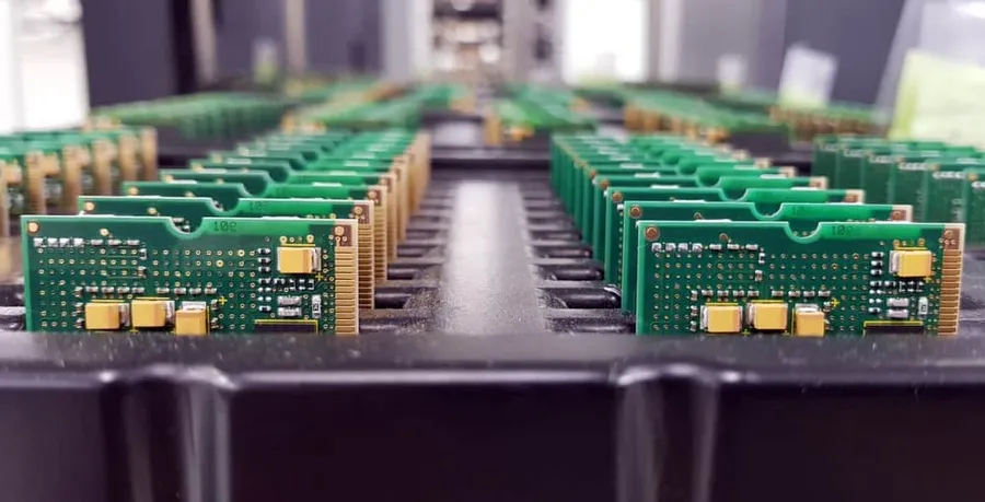 A factory floor with equipment used for manufacturing PWBs.