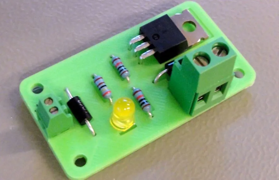 A 3D printer fabricating a circuit board layer by layer.