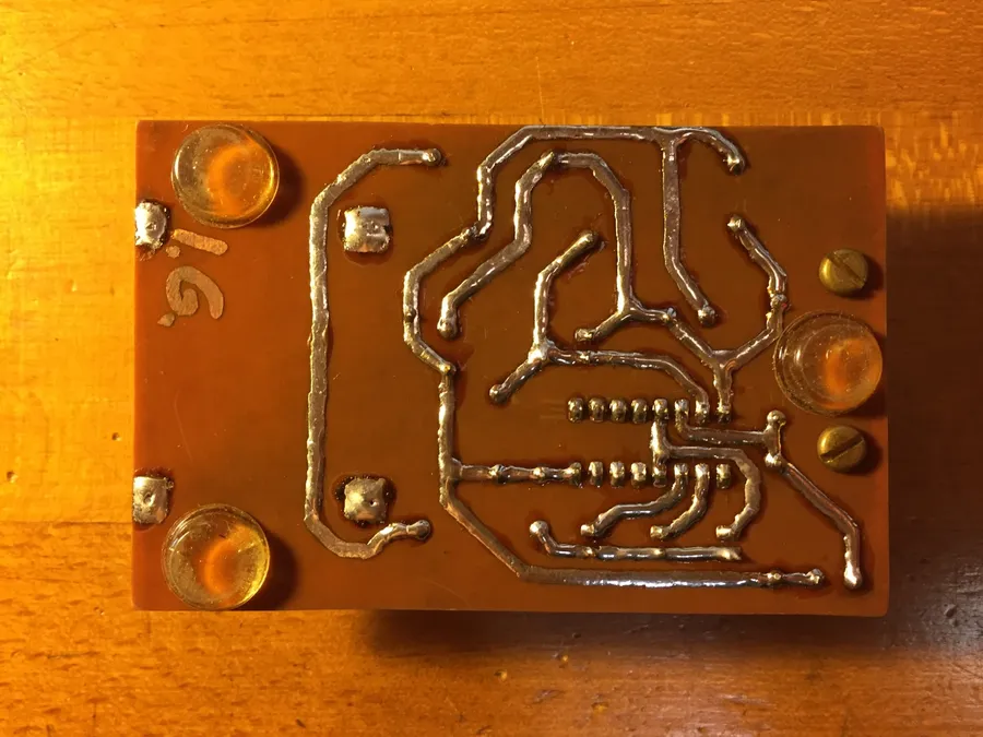 A pre-etched PCB showing defined patterns before component assembly.