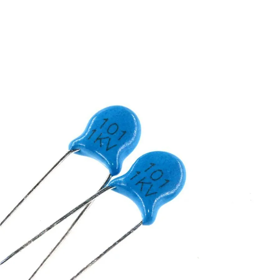 A small ceramic capacitor labeled with 100pF value.