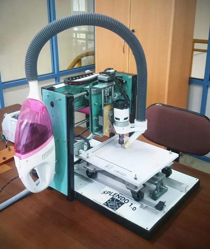 Engineer operating a PCB prototyping machine