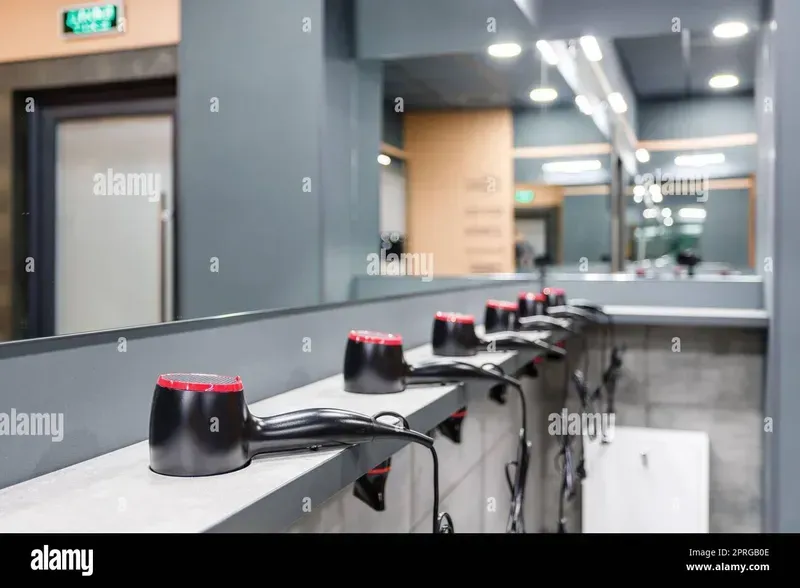A shared hair dryer installed in a gym