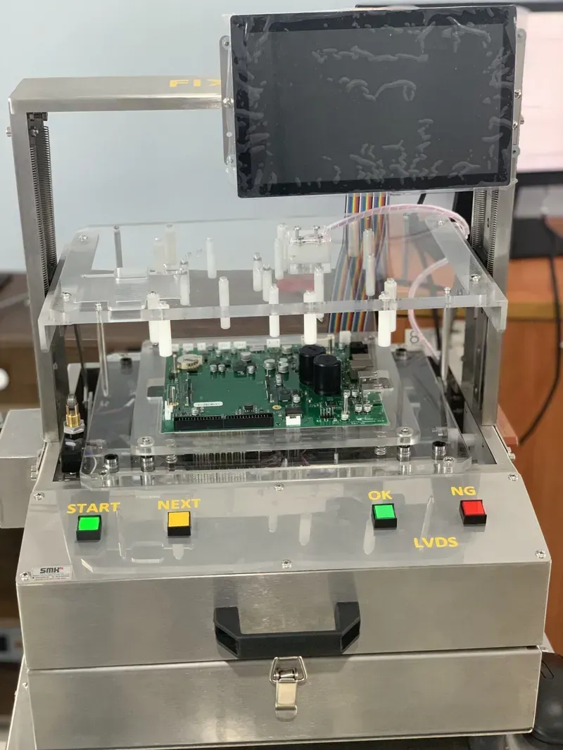 An automated machine testing a circuit board for quality assurance