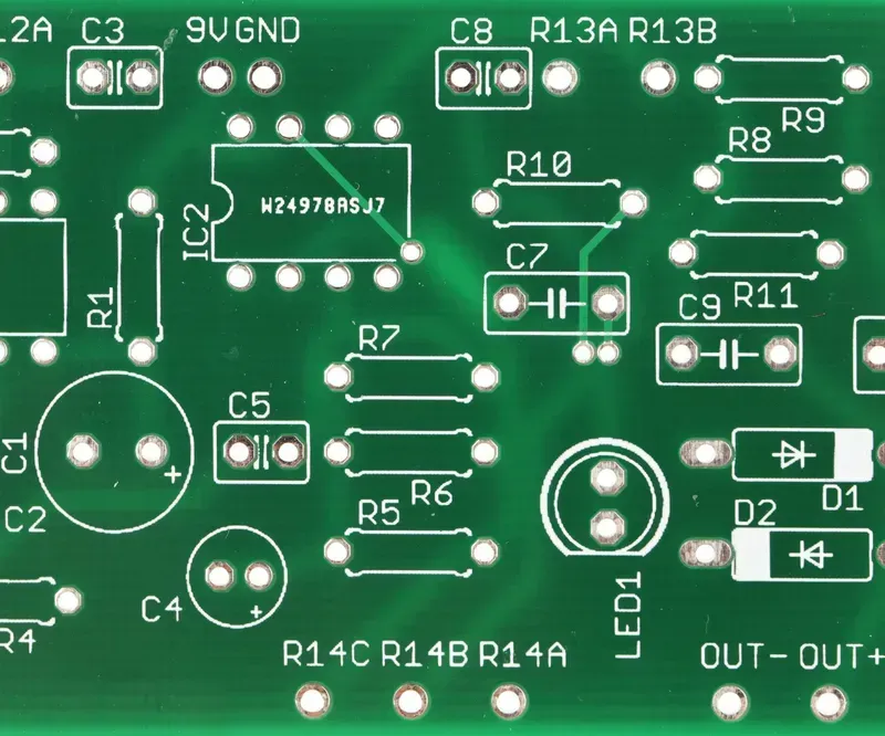 An engineer designing a PCB circuit board on a computer