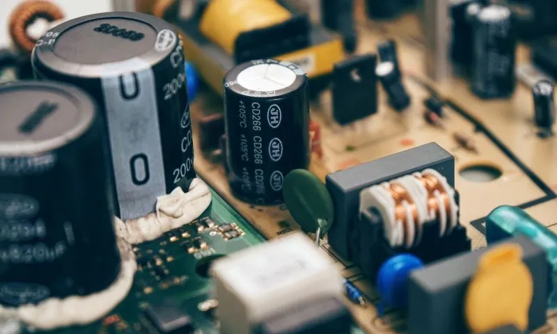 Capacitors mounted on a circuit board in a electronic device.