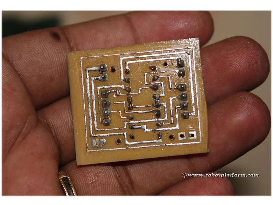 A PCB undergoing the etching process during manufacturing.