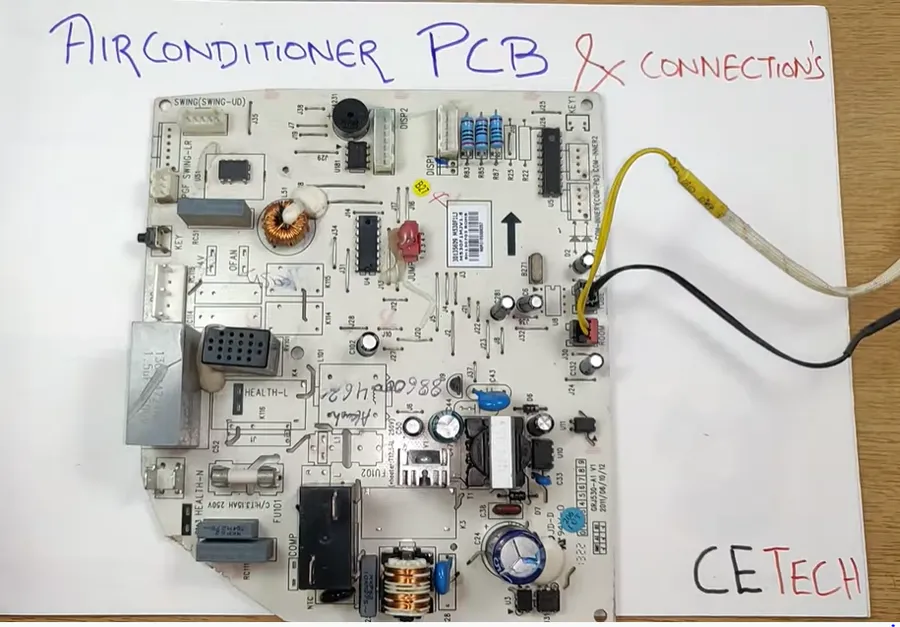 A detailed view of electronic components on an AC circuit board.