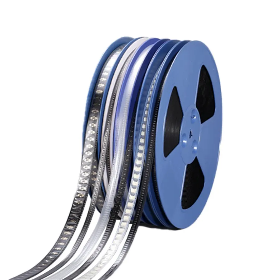 Various reels of SMD components used in PCB assembly.