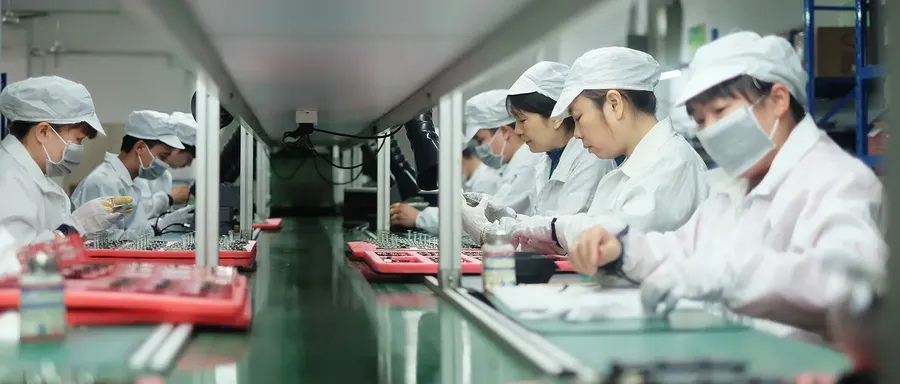 A PCB assembly line with pick and place and other machines.
