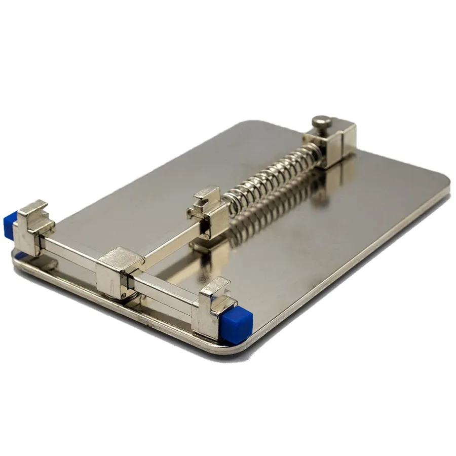 A PCB stand surrounded by various tools for phone repair.