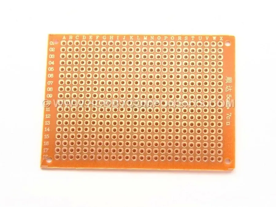 A DIY PCB board with components being placed.