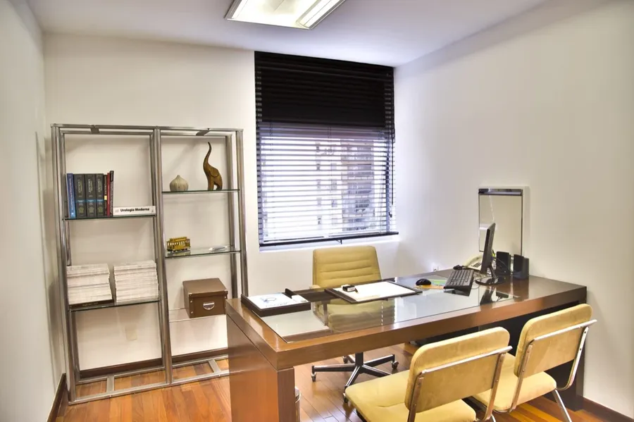 A typical small office setup with people working on computers, representing a small business environment.