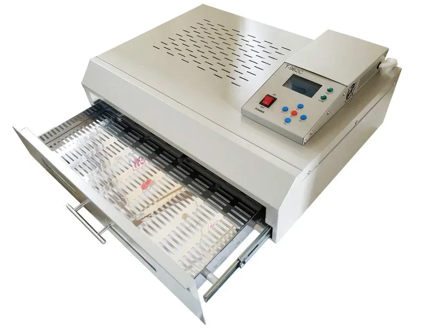 A PCB going through a reflow soldering oven.