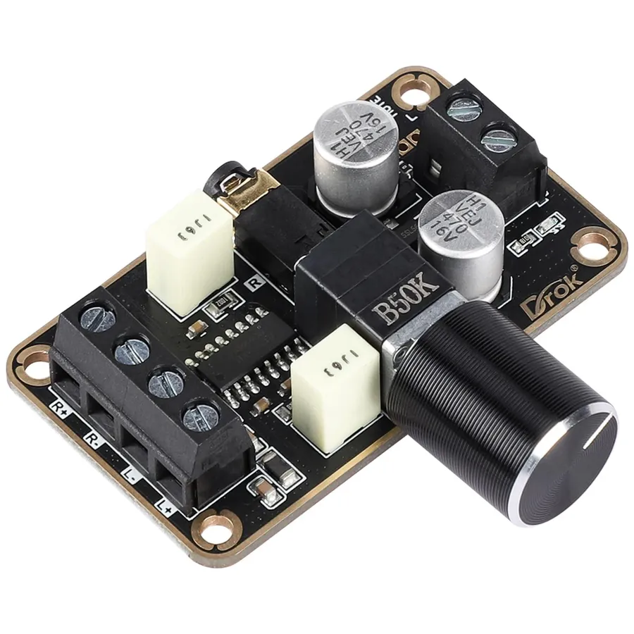 Amplifier board connected to audio testing equipment.