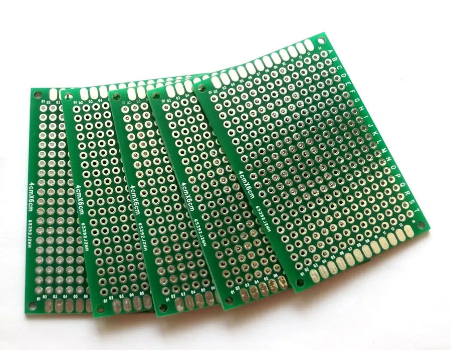 Two different PCBs placed side by side for comparison.