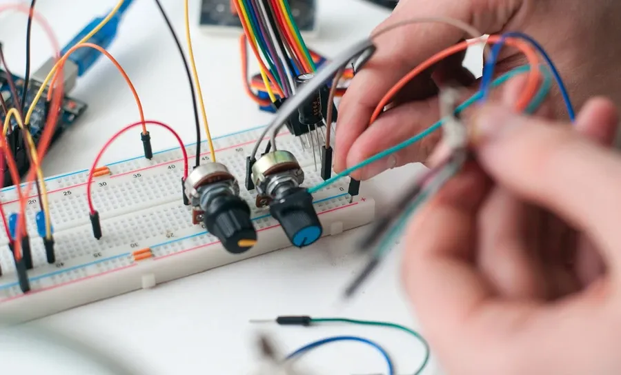 A breadboard with electronic components creating a circuit prototype.