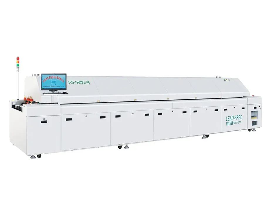 A reflow oven machine in a PCB assembly process.