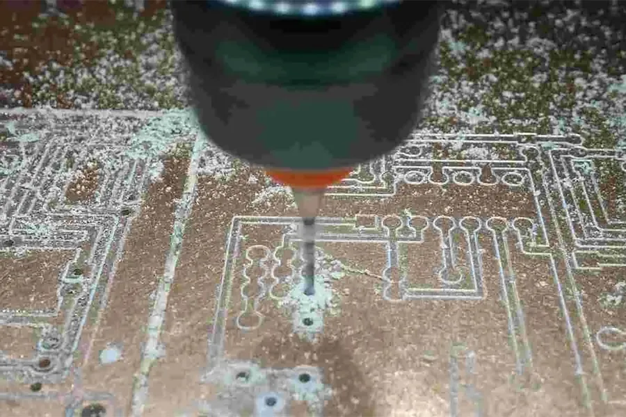 A PCB being drilled during fabrication.