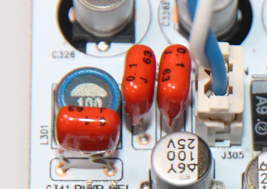 A film capacitor mounted on a circuit board.