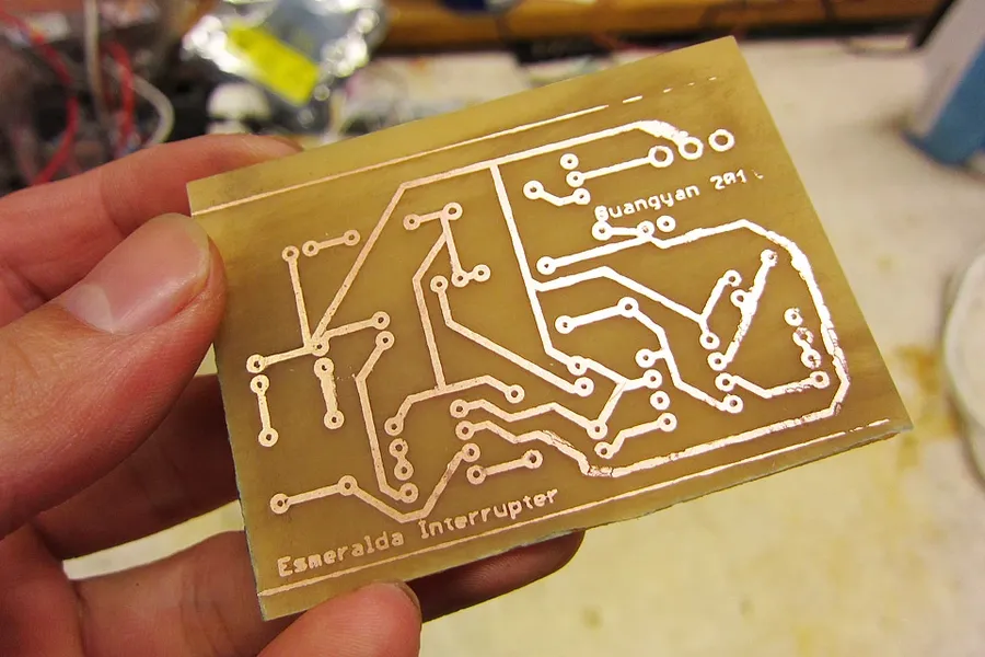 A homemade PCB on a workbench.