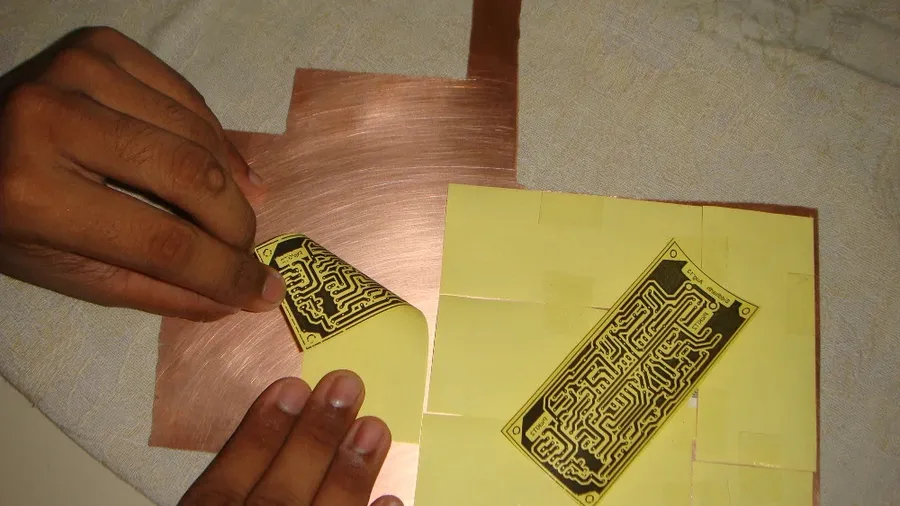 A PCB design transferred onto copper clad using toner transfer method.