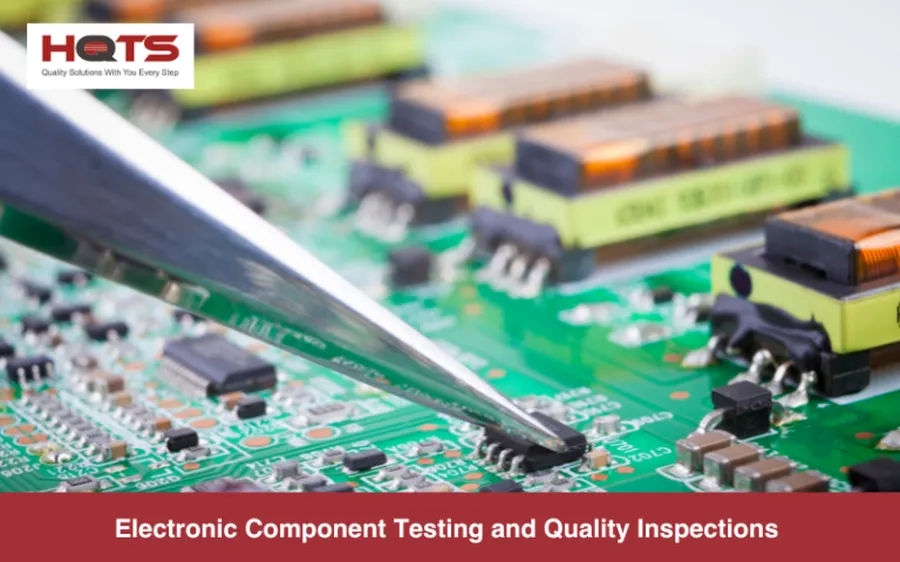 A person using a magnifying glass to inspect electronic components.