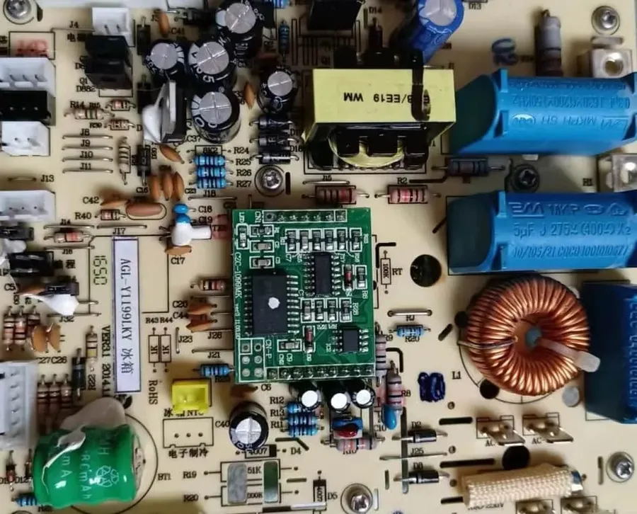 Various electronic components on a refrigerator PCB.