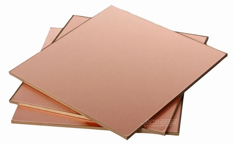 Close-up of various copper clad board materials showing different textures and composition.
