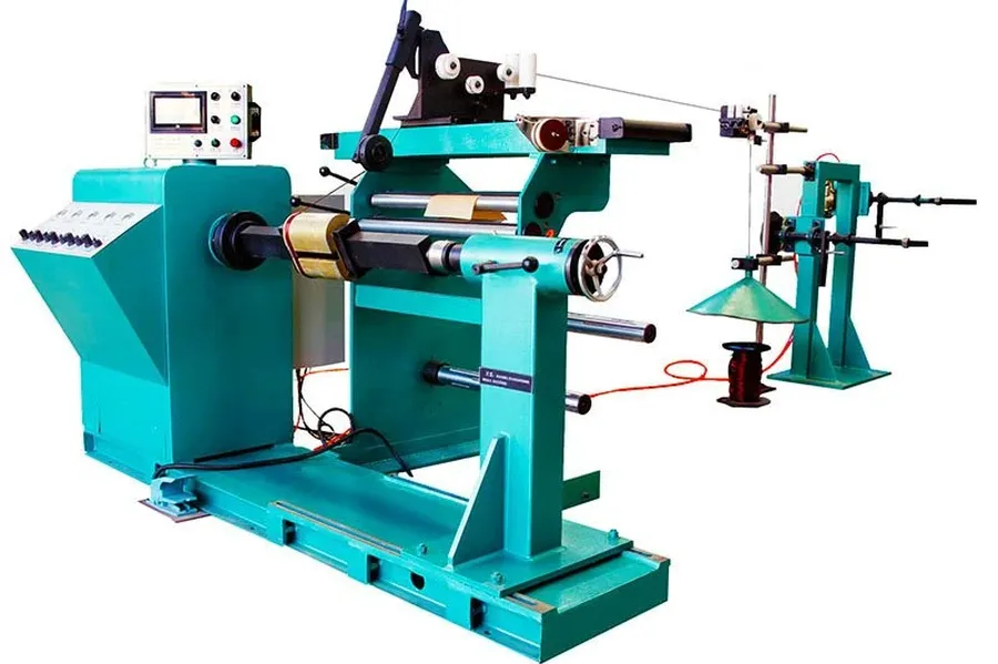 A machine winding copper wire onto a transformer core.