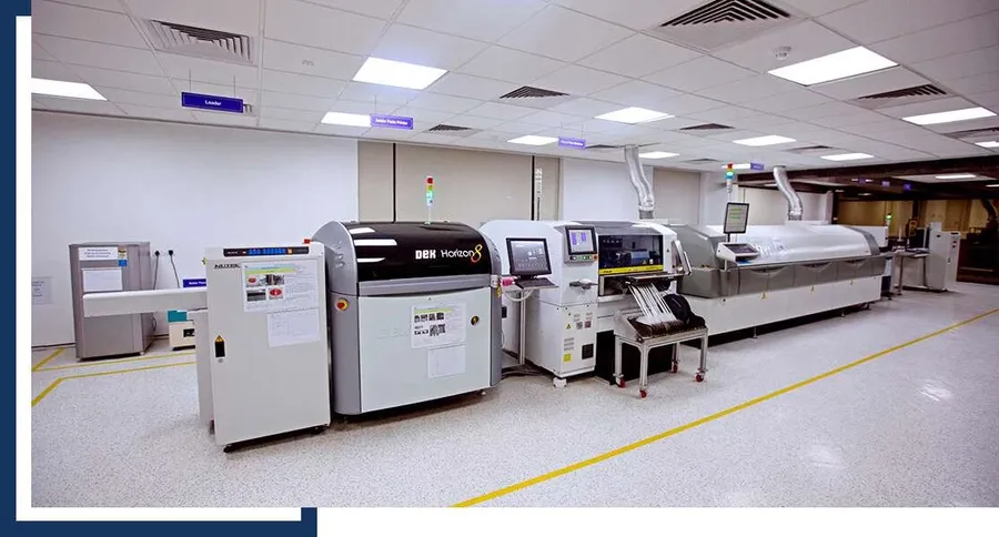 An SMT assembly line with various equipment.