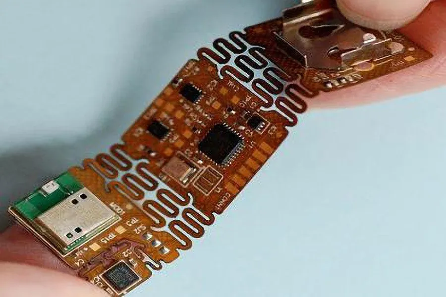 A factory scene with workers assembling flexible PCBs.