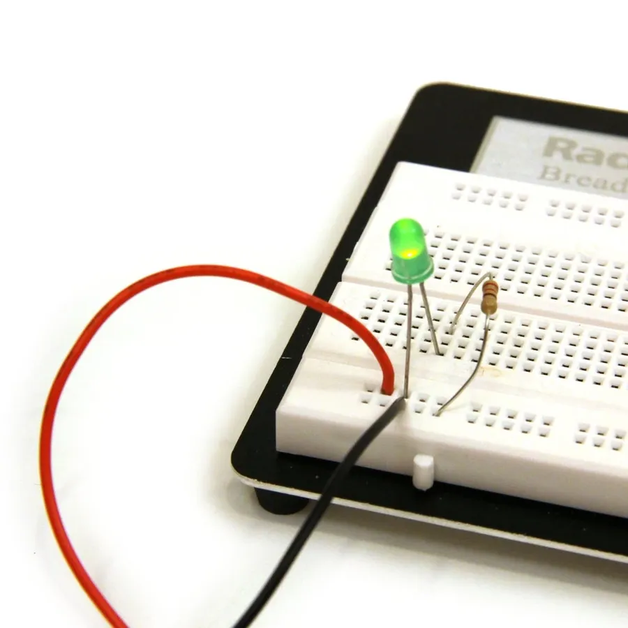 A breadboard with resistors connected to demonstrate series and parallel configurations.