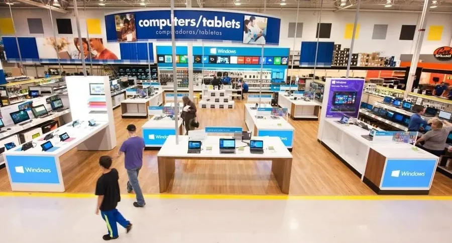The interior of an electronics store with shelves of products.