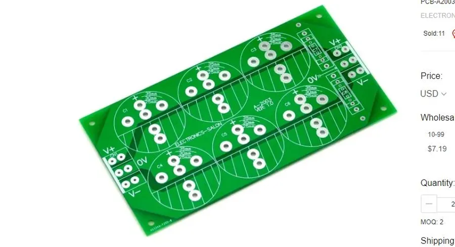 A close-up view of a printed circuit board with capacitors in a parallel configuration.
