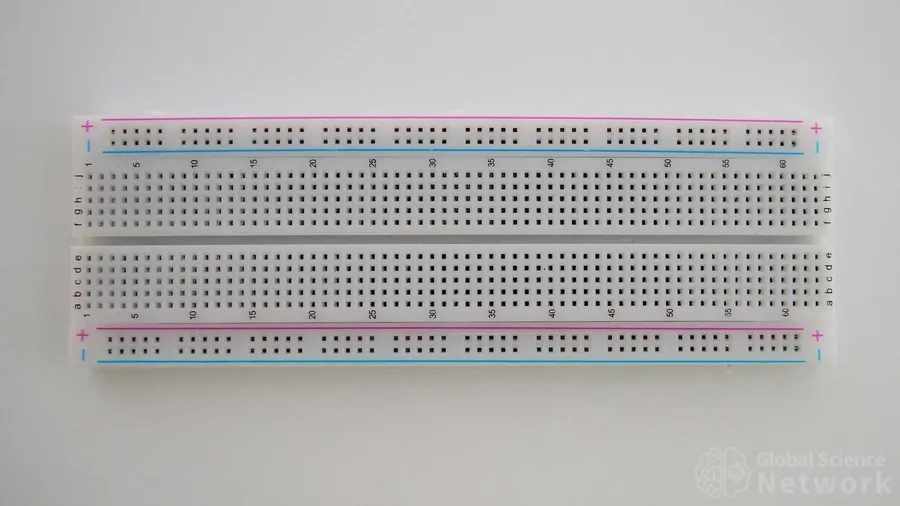 A breadboard with a simple LED circuit including a 1k resistor.