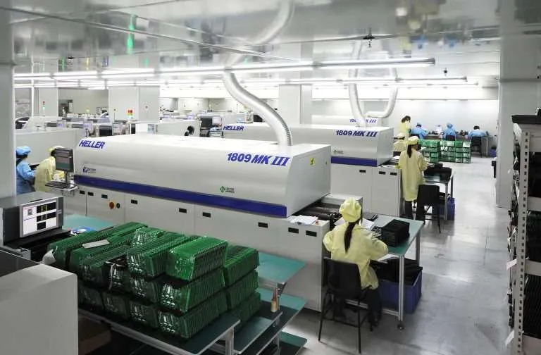 An overview of a PCB manufacturing workshop with various equipment.