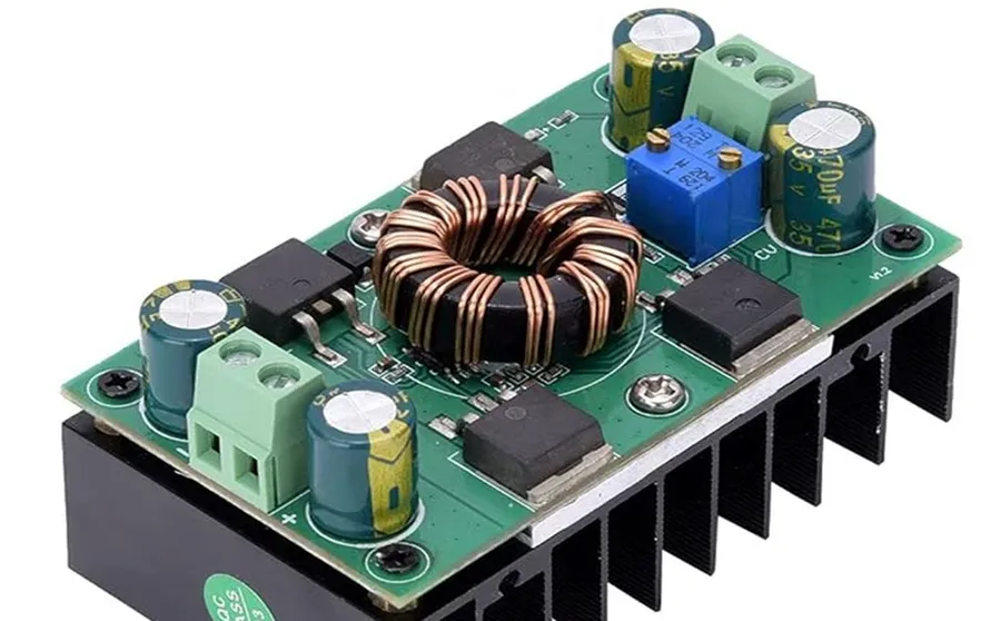 A detailed view of a PCB with power supply components such as capacitors and voltage regulators.