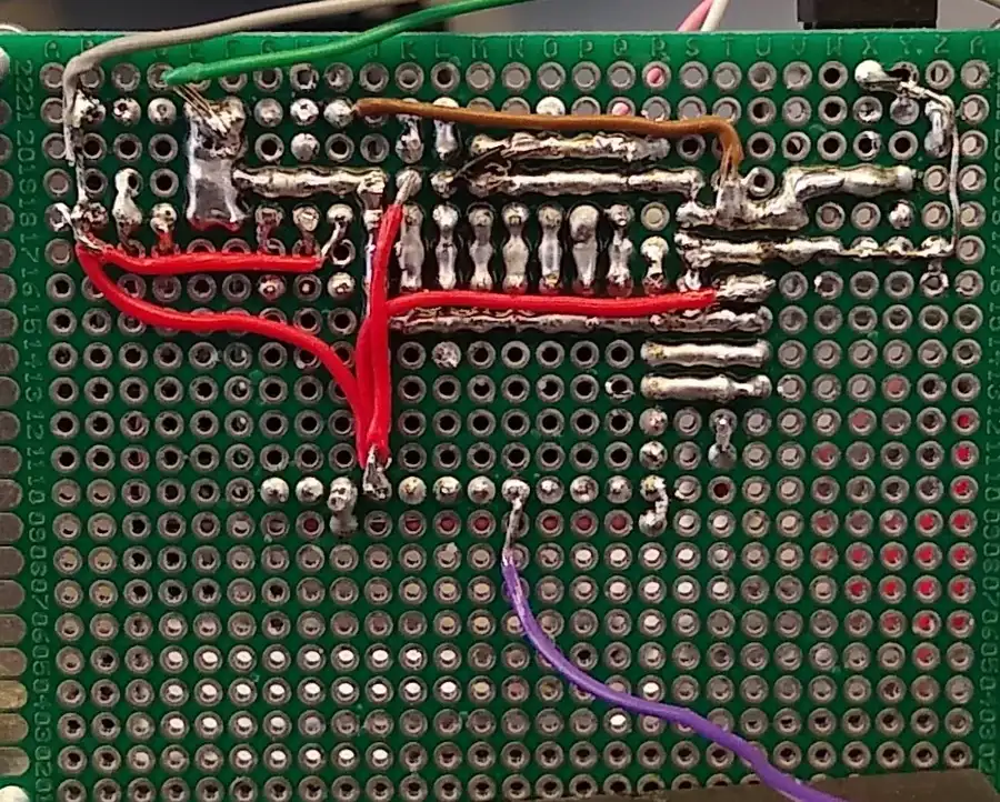 A PCB prototype being soldered for testing.