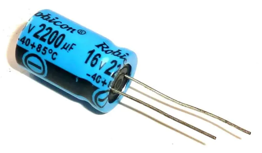 Different types of capacitors on a circuit board, including ceramic and electrolytic capacitors.