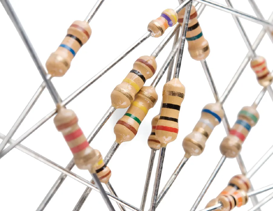 A variety of resistors with different color codes on a circuit board.