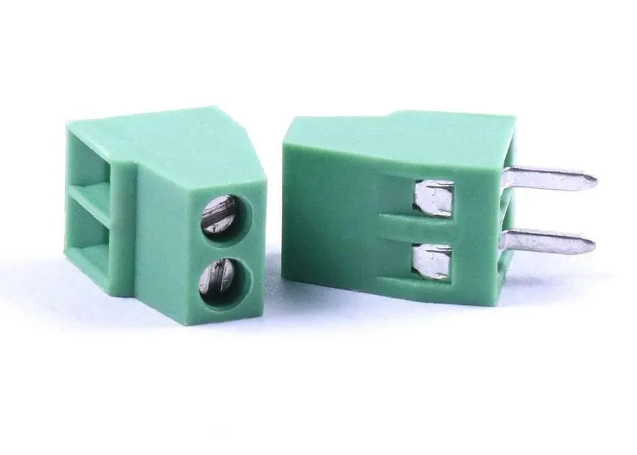 Different types of connectors on a circuit board, such as headers and sockets.